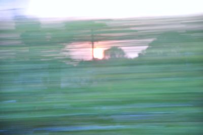 Defocused image of field against sky