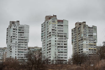 Abandoned high-rise building of the soviet union in the winter in the city