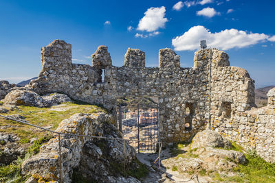 Low angle view of old ruins against sky