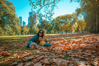 Rear view of woman walking on field