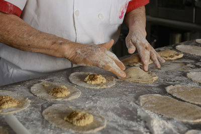 Chef preparing delicious mexican empanadas