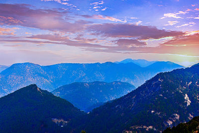 Scenic view of mountains against sky during sunset
