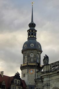 Low angle view of historic building against cloudy sky