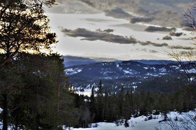 Scenic view of mountains against sky during winter