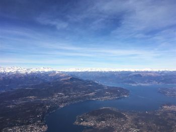 Aerial view of sea and mountain against sky