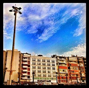 Low angle view of buildings against blue sky