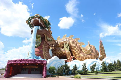 Low angle view of statue against sky