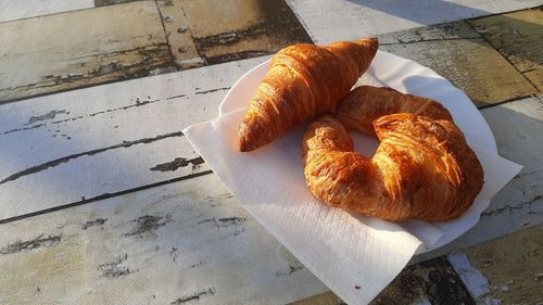 Close-up of croissants on table