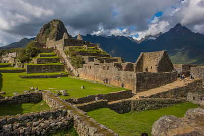 Ruins of building against cloudy sky