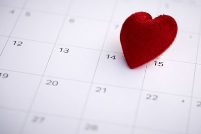 High angle view of heart shape on calendar