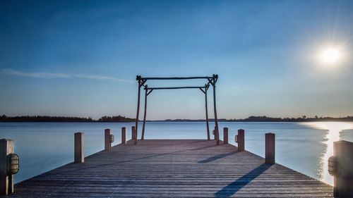 Pier over sea against sky