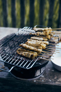 Close-up of meat on barbecue grill