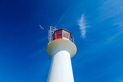 Low angle view of lighthouse against blue sky