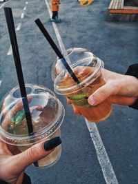 Cropped image of hand holding glass