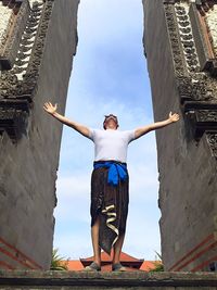 Low angle view of cross against the sky