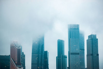 Skyscrapers in city against sky