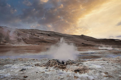 Scenic view of steaming fumarole in geothermal area of hverir at namafjall