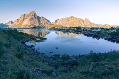 Panoramic view of sea and mountains against clear sky