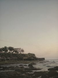 Scenic view of sea against clear sky during sunset