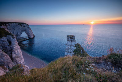 Scenic view of sea against sky during sunset