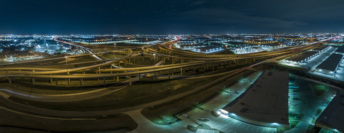 High angle view of illuminated buildings in city at night