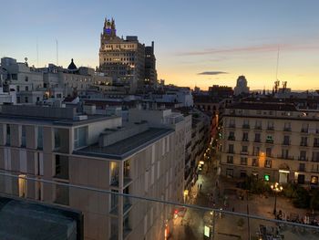 High angle view of buildings against sky at sunset