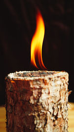Close-up of burning flames on wood