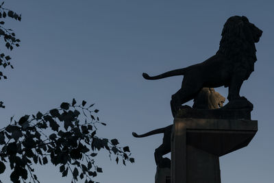 Low angle view of statue against clear sky
