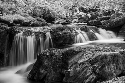 Long exposure of a waterfall on the hoar oak water river at watersmeet in exmoor 