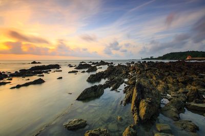 Scenic view of sea against sky at sunset