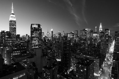 Aerial view of city lit up at night