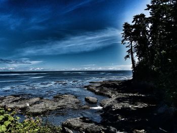 Scenic view of sea against cloudy sky