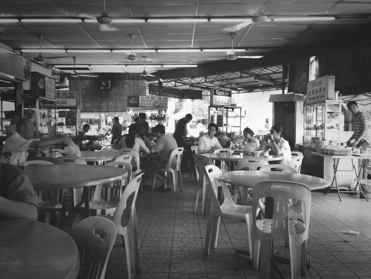 indoors, chair, restaurant, table, men, person, lifestyles, large group of people, sitting, cafe, food and drink, arrangement, incidental people, leisure activity, food and drink industry, retail, sidewalk cafe, place setting, seat