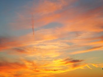 Low angle view of dramatic sky during sunset