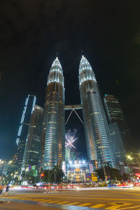 Illuminated modern buildings in city at night