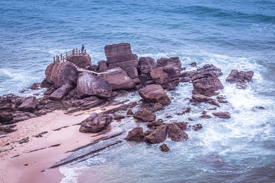 High angle view of rocks in sea