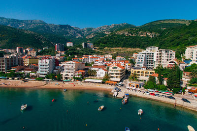 High angle view of townscape by sea