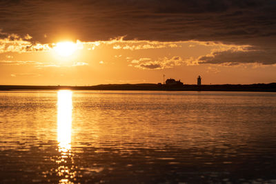 Scenic view of sea against romantic sky at sunset