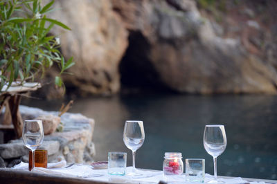 Close-up of wine glasses on table