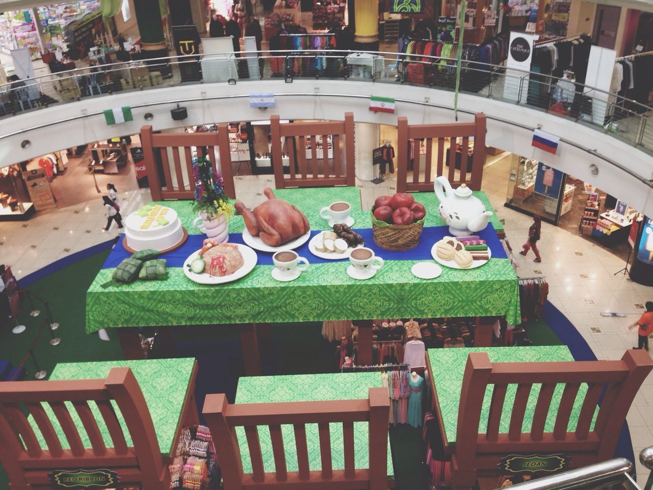 table, restaurant, text, chair, high angle view, indoors, variation, arrangement, incidental people, day, art, western script, food and drink, cafe, still life, creativity, communication, wood - material, retail, art and craft