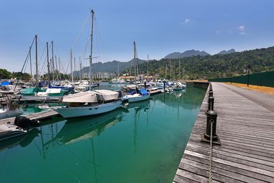 Boats moored at harbor