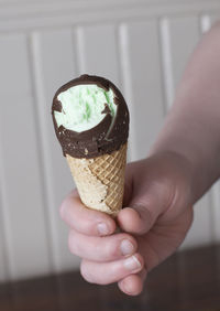 Midsection of person holding ice cream cone