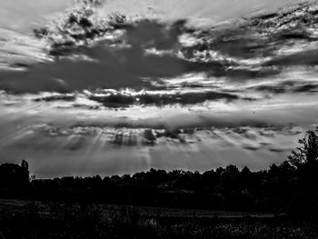 Scenic view of dramatic sky over land