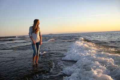 Teenage girl on beach at evening, oland, sweden