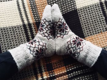 High angle view of hand on sofa at home