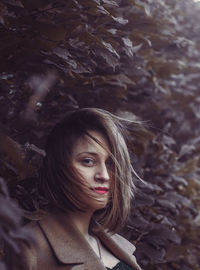 Portrait of young woman looking away