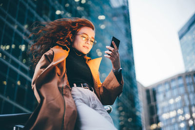 Young woman using mobile phone