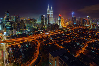 High angle view of illuminated cityscape at night