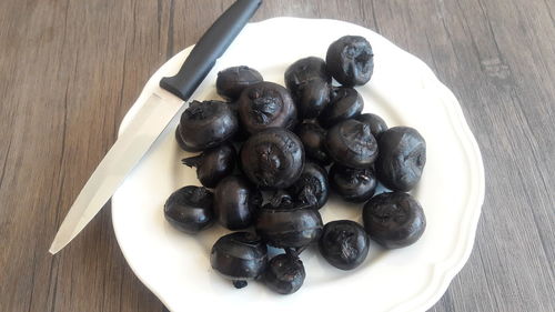 High angle view of black coffee in plate on table