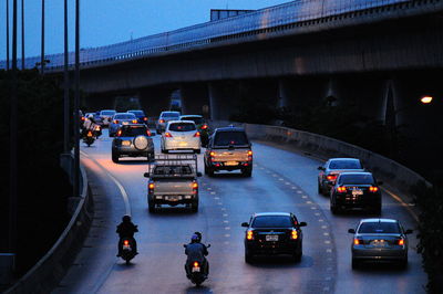 Rear view of vehicles on road